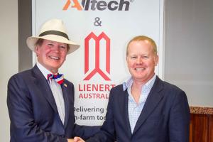 Alltech founder and president Dr. Pearse Lyons with Nick Lienert upon the signing of the agreement for purchasing Lienert Australia.