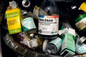 Empty antibiotic and hormone bottles in a bin on a pig farm in Germany. Photograph: Alamy Stock Photo